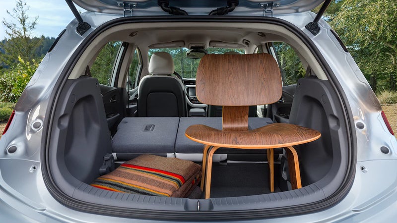 Chevrolet Bolt trunk open, showing spacious cargo with items inside.