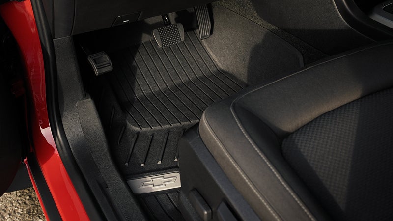 Chevrolet Colorado driver's side floor with pedals and branded rubber mat