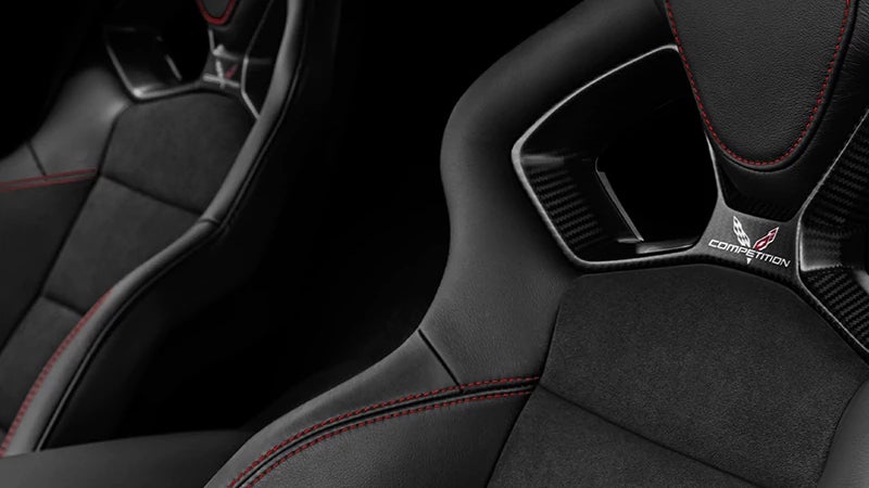 Close-up of black leather competition sport seats in a 2018 Chevrolet Corvette with red stitching
