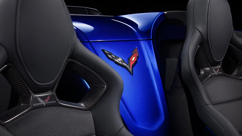Back view of Corvette competition seats with blue rear panel and Corvette emblem