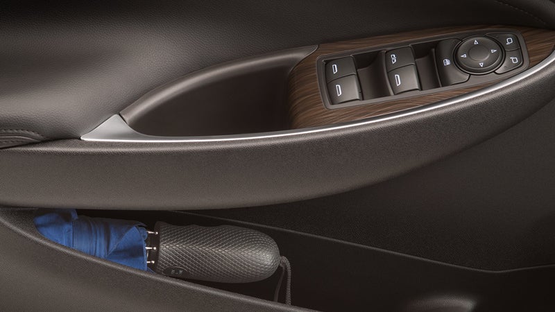 Side door view of Chevrolet Malibu open like a window, papers fluttering inside.