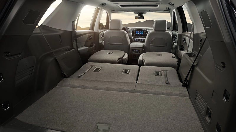 Rear cargo area of the 2018 Chevrolet Traverse with all seats folded flat for maximum storage capacity.