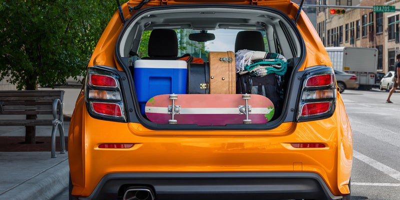 Chevrolet Sonic's trunk loaded with luggage.