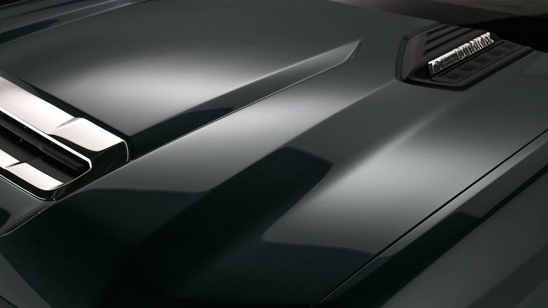 Close-up of Chevrolet Silverado HD hood with Duramax badge and vent.