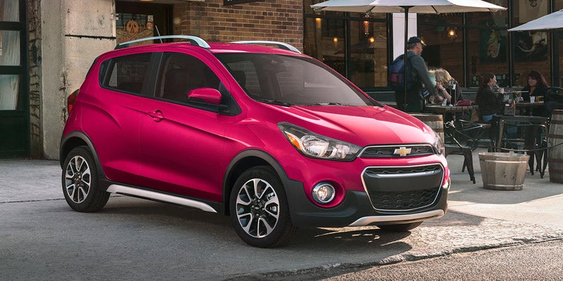 Chevrolet Spark parked in front of Cafe