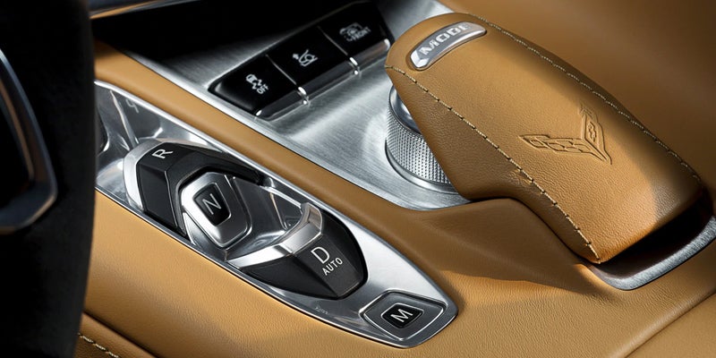 Close-up of Corvette’s gear selector with leather detailing and drive mode dial