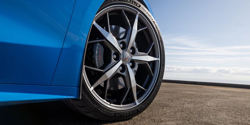 Close-up of Corvette's wheel and tire with visible brake caliper and Michelin tire branding