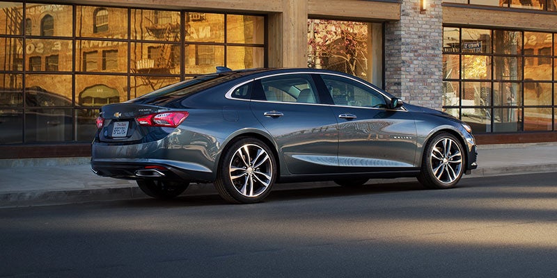 Sleek Chevrolet Malibu reflecting city vibes