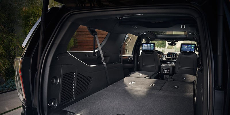 Interior of Chevrolet Suburban with seats folded, showing large cargo space