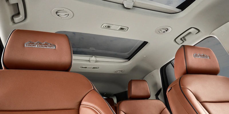 Close-up of 2021 Traverse High Country front seats and panoramic sunroof