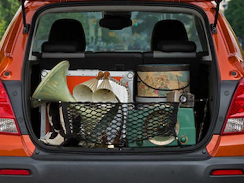 Rear cargo area of a 2016 Chevrolet Trax filled with vintage items, demonstrating storage capacity.