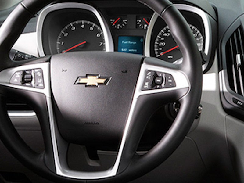 Close-up of the steering wheel and instrument cluster in the 2016 Chevrolet Equinox.