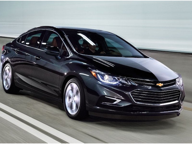 2017 Chevrolet Cruze in motion on a highway, black exterior, sleek aerodynamic design, front and side view