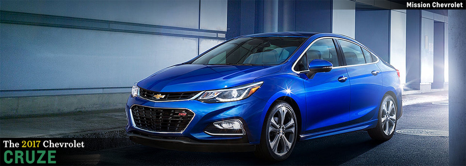 2017 Chevrolet Cruze in blue parked under modern building overhang, shown from front passenger side view