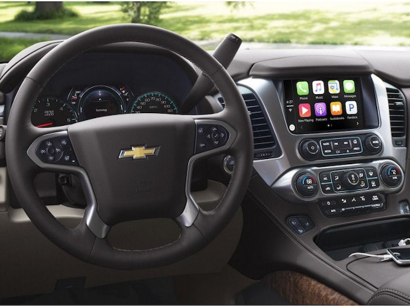 2017 Chevrolet Suburban interior with Apple CarPlay displayed on the touchscreen