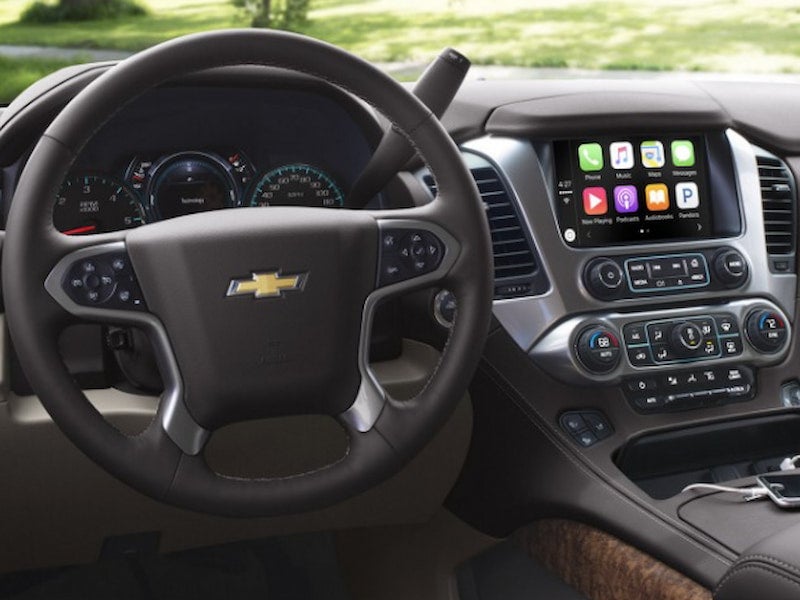 Interior of the 2017 Chevrolet Tahoe showing steering wheel and infotainment system